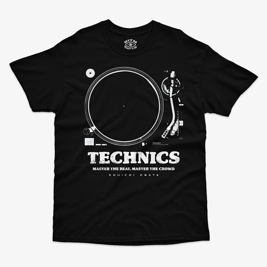 Polera de color negro. Diseño frontal con un dibujo técnico o blueprint de la tornamesa Technics