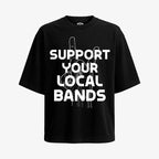 Polera negra, corte oversized, con el diseño "Apoya Tus Bandas Locales" en blanco. Muestra la mano haciendo cuernos de rock.