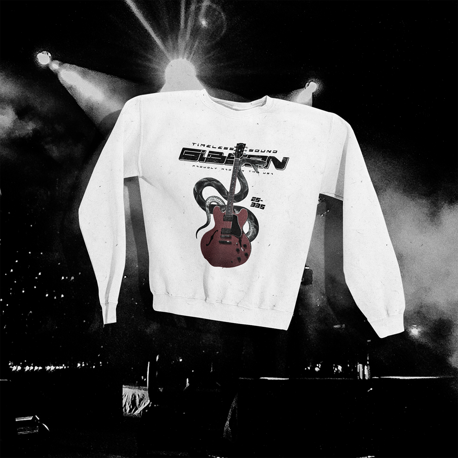 Polerón blanco con diseño de guitarra Gibson ES-335 roja flotando sobre fondo oscuro de escenario de concierto con luces