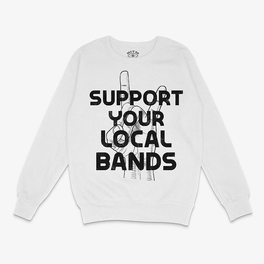 Polerón de cuello redondo de color blanco. Diseño "Apoya Tus Bandas Locales" en negro, con la mano haciendo cuernos de rock