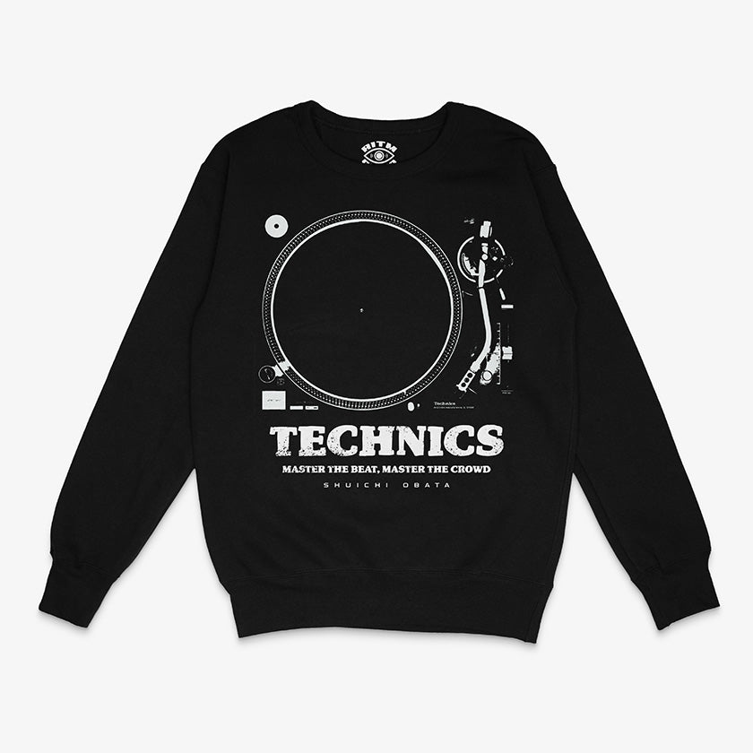 Polerón de cuello redondo de color negro. Diseño frontal con un dibujo técnico o blueprint de la tornamesa Technics